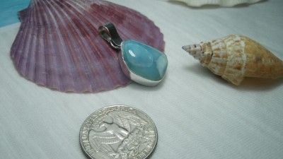 Larimar (also lorimar) is a rare blue variety of pectolite found only 