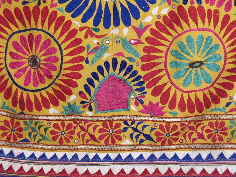   hanging throw in yellow red and blue with exquisite intricate heavy